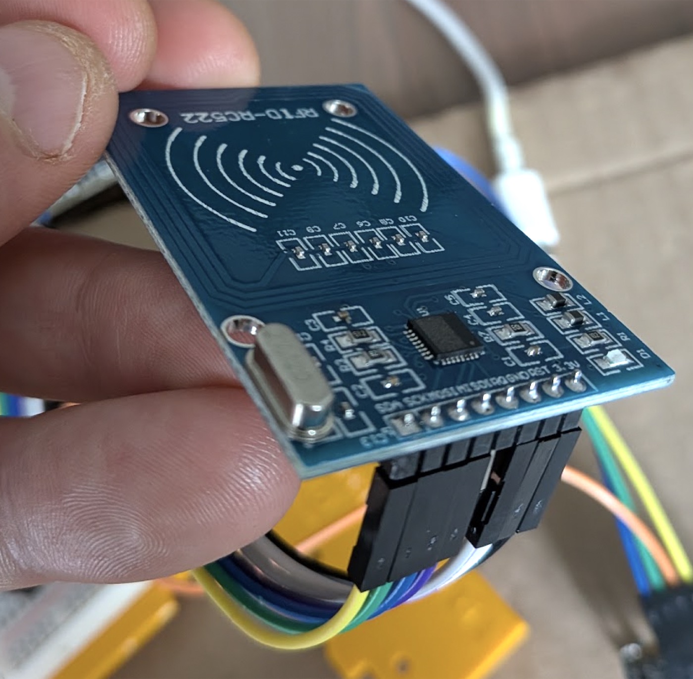 The RC522 with its header soldered pins-down, connected with Dupont wires